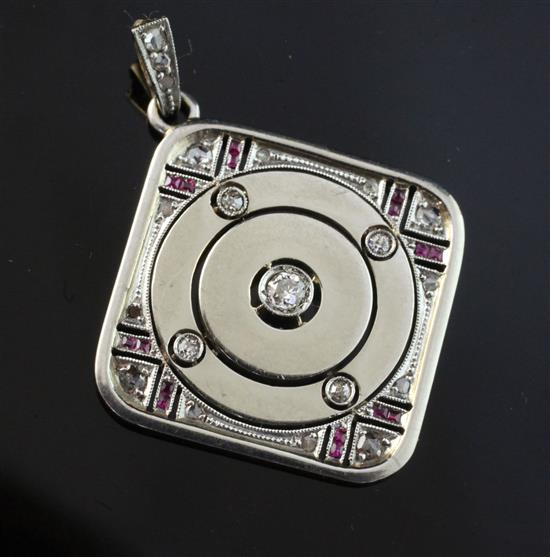 A 1930s/1940s gold and white metal, ruby and diamond pendant, 1.5in inc. bale.